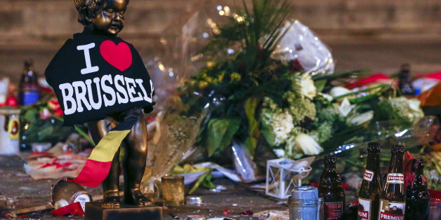 A replica of the Manneken-Pis statue, a major Brussels tourist attraction, is seen among flowers at a memorial for the victims of bomb attacks in Brussels metro and Brussels international airport of Zaventem, in Brussels