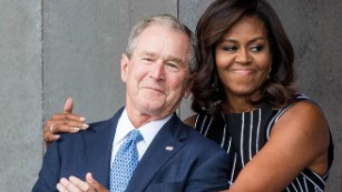 160924185453-michelle-obama-george-w-bush-hug-sept-24-medium-plus-169